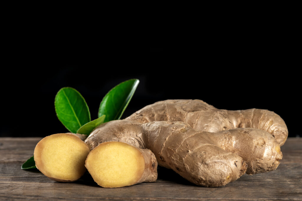 fresh ginger on wooden background